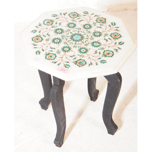 818 - A contemporary inlaid benares manner pietra dura marble side table. The table having an octagonal ma... 