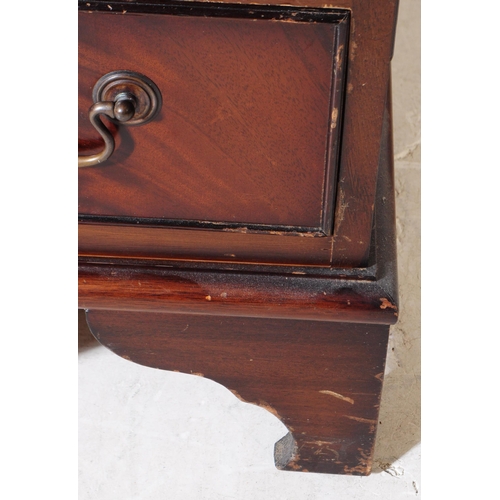 821 - A 19th century revival mahogany pedestal desk. The desk raised on twin pedestals, each having bracke... 