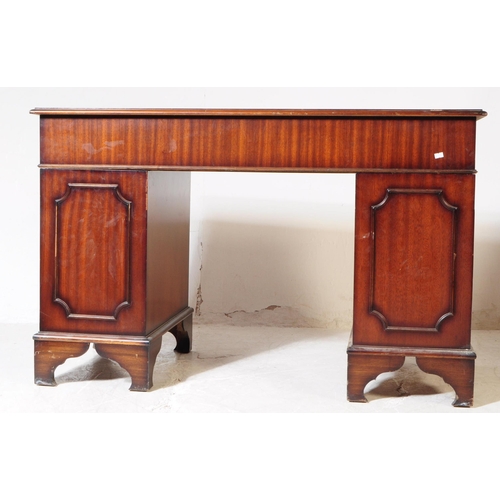 821 - A 19th century revival mahogany pedestal desk. The desk raised on twin pedestals, each having bracke... 