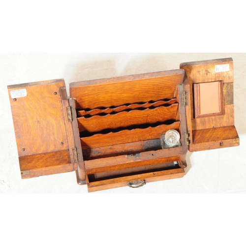 822 - An Victorian 19th century oak wood sloped top desk tidy letter rack. The desk tidy of rectangular fo... 