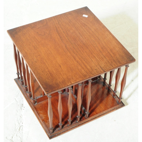 823 - An early 20th century Edwardian walnut revolving bookcase cabinet, alongside another similar desktop... 