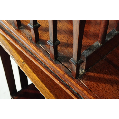 823 - An early 20th century Edwardian walnut revolving bookcase cabinet, alongside another similar desktop... 