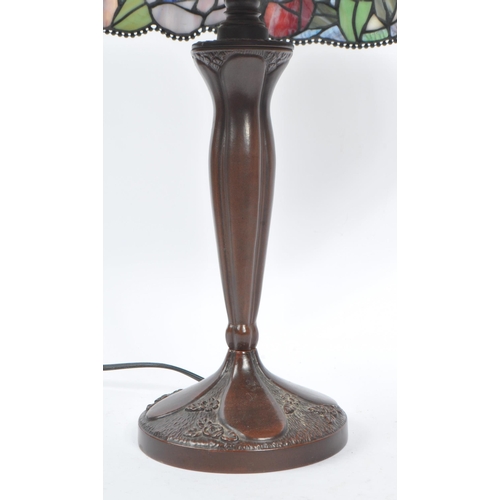 826 - A 20th Century Tiffany style table lamp light with dual lamp bulb sockets having pink and purple sta... 