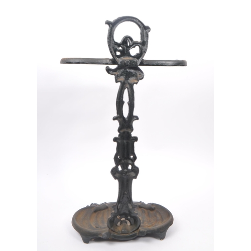 830 - A Victorian 19th century cast iron Coalbrookdale manner stick / umbrella stand. The stand raised on ... 