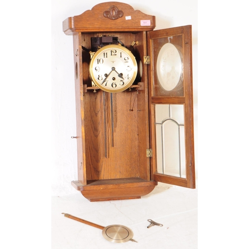 831 - Friedrich Mauthe - A 19th century FMS Mauthe 8-day movement oak cased wall clock. The clock having s... 