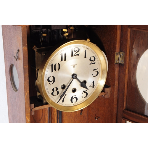 831 - Friedrich Mauthe - A 19th century FMS Mauthe 8-day movement oak cased wall clock. The clock having s... 