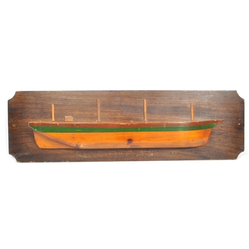 834 - A wooden plaque depicting model of boat / ship with writing underneath reading: ' Largiemore Built 1... 