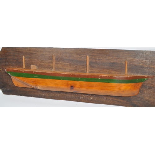 834 - A wooden plaque depicting model of boat / ship with writing underneath reading: ' Largiemore Built 1... 