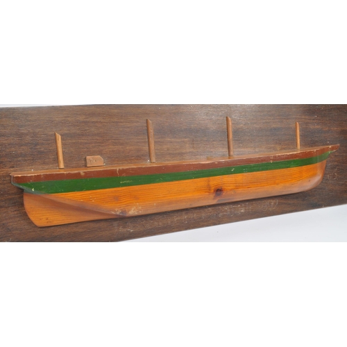 834 - A wooden plaque depicting model of boat / ship with writing underneath reading: ' Largiemore Built 1... 