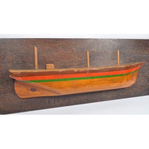 835 - A wooden plaque depicting model of boat / ship with writing underneath reading: ' Dido Built Hull 18... 