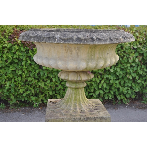 836 - A collection of three outdoor vintage 20th century reconstituted stone composite Campana garden urns... 