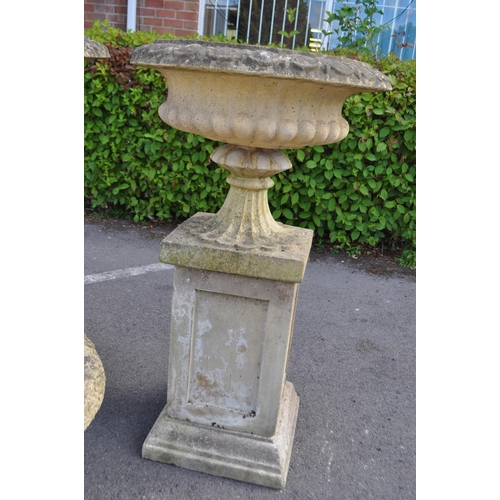 836 - A collection of three outdoor vintage 20th century reconstituted stone composite Campana garden urns... 