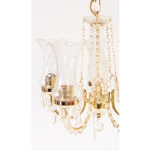 838 - An Italian made glass and brass five arm chandelier with central glass column in a spun design, with... 