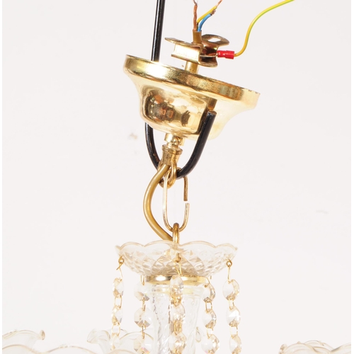 838 - An Italian made glass and brass five arm chandelier with central glass column in a spun design, with... 