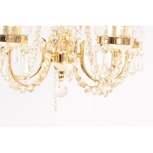 838 - An Italian made glass and brass five arm chandelier with central glass column in a spun design, with... 