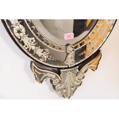 840 - A 20th century engraved Venetian mirror, of large oval form with decorative cresting to top and cent... 