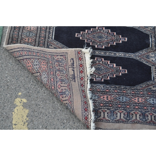 846 - A collection of five bokhara small proportioned Persian manner floor rugs. Each rug being of varied ... 