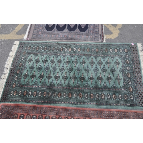 846 - A collection of five bokhara small proportioned Persian manner floor rugs. Each rug being of varied ... 