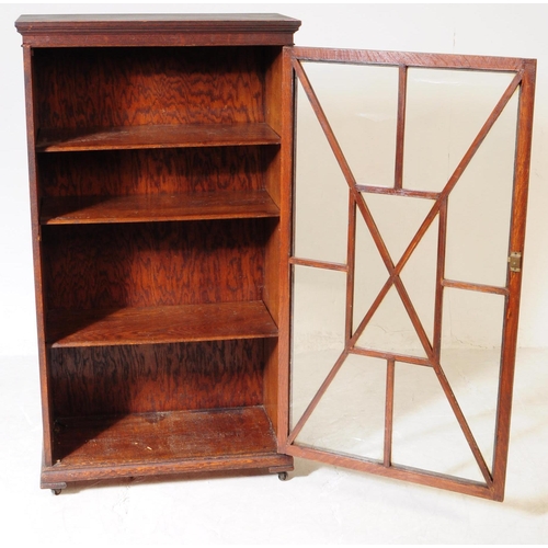 856 - A 19th century Victorian oak wood glazed bookcase cabinet. The bookcase having astragal glazed windo... 