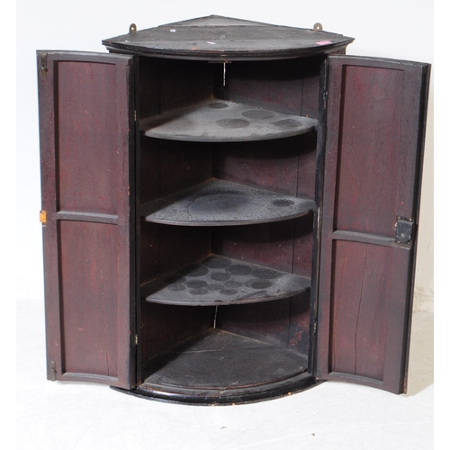 858 - Two 19th century George III chinoiserie wall corner cabinets. Twin curved door with shelved interior... 