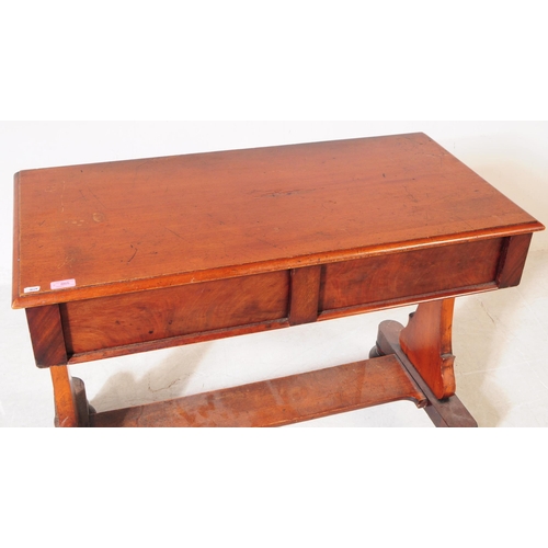 865 - A 19th century George III mahogany hall / writing table. Rectangular form with trestle supports term... 