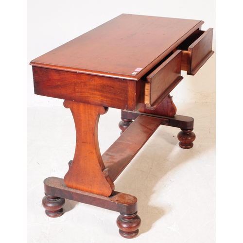 865 - A 19th century George III mahogany hall / writing table. Rectangular form with trestle supports term... 