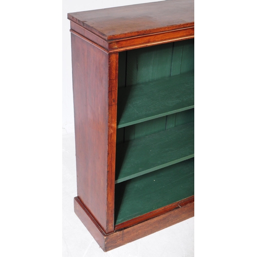 868 - A Victorian mahogany 19th century open face bookcase. Rectangular form with green painted shelved in... 