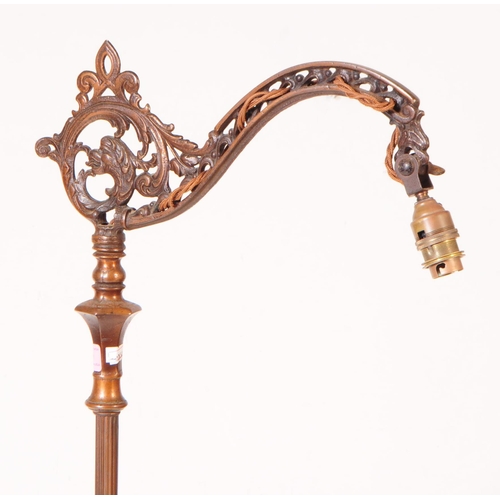 869 - A early 20th century brass Art Nouveau floor standing lamp light. With scrolled ornate detail arm, o... 