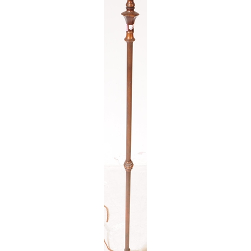 869 - A early 20th century brass Art Nouveau floor standing lamp light. With scrolled ornate detail arm, o... 