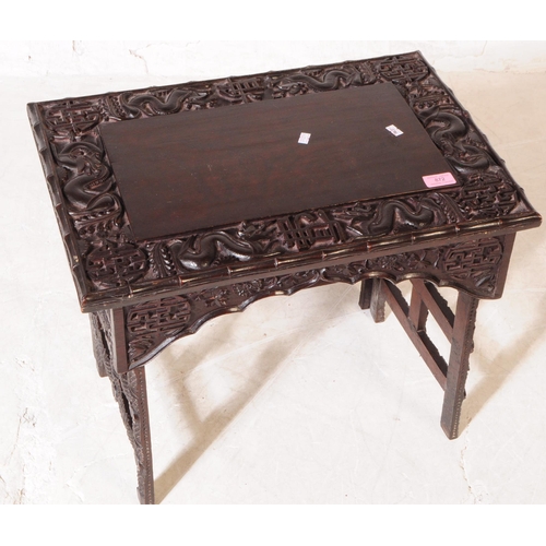 872 - A 19th Century Chinese ebonised hardwood Scholar's writing desk table. Having carved detailing depic... 