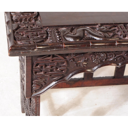 872 - A 19th Century Chinese ebonised hardwood Scholar's writing desk table. Having carved detailing depic... 