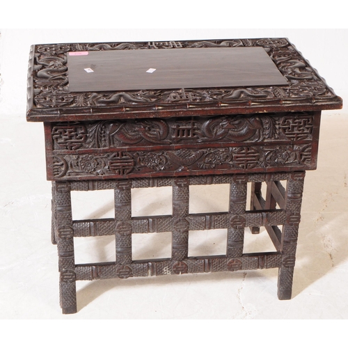 872 - A 19th Century Chinese ebonised hardwood Scholar's writing desk table. Having carved detailing depic... 