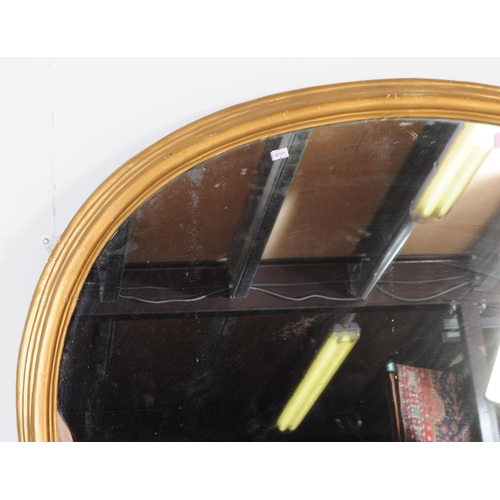 880 - A 19th century Victorian giltwood and gesso frame hanging wall mirror. Having a shaped gilt wood fra... 