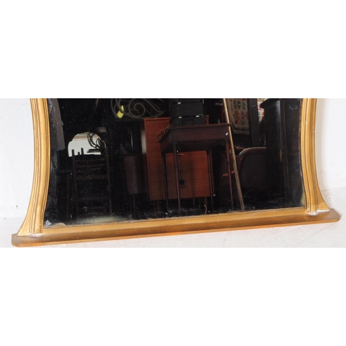 880 - A 19th century Victorian giltwood and gesso frame hanging wall mirror. Having a shaped gilt wood fra... 