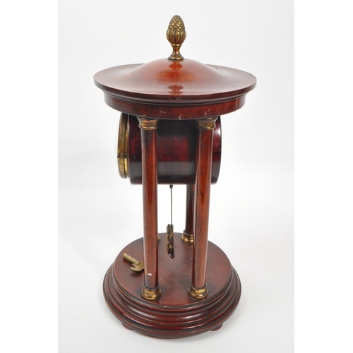 886 - A 19th century Victorian portico clock, being of stained walnut with acorn finial to top, white flor... 