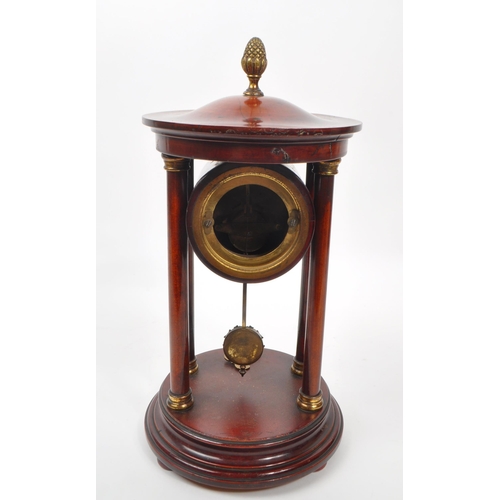 886 - A 19th century Victorian portico clock, being of stained walnut with acorn finial to top, white flor... 