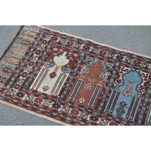 887 - A 20th century Turkish Kayseri / Saff manner Islamic prayer runner carpet rug. The rug featuring win... 