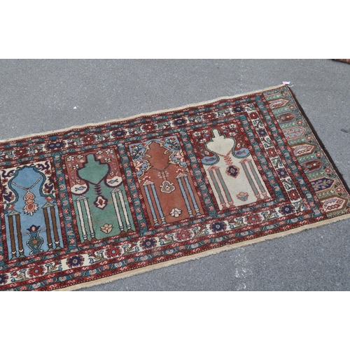 887 - A 20th century Turkish Kayseri / Saff manner Islamic prayer runner carpet rug. The rug featuring win... 