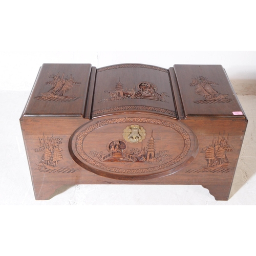 898 - A vintage 20th century oriental Chinese carved camphor wood blanket box. Rectangular form with carve... 