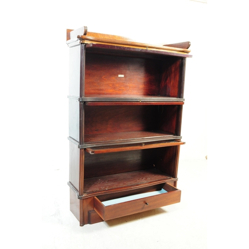 912 - A 1920s oak three-tier sectioned lawyers barristers bookcase / library stacking cabinet in the manne... 