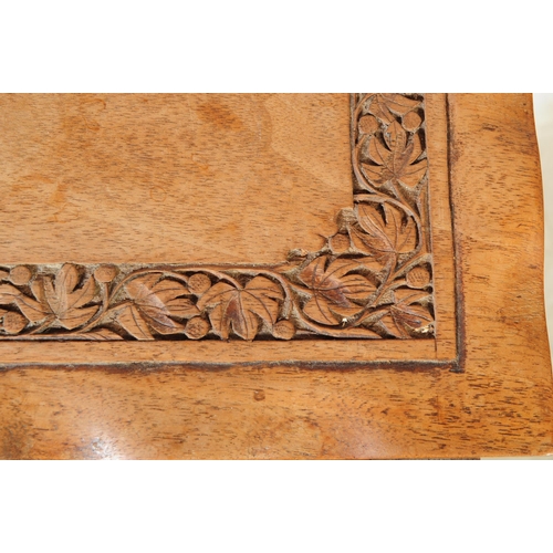 916 - A 20th Century Chinese hardwood nest of coffee tables having carved leaf detailed border and undulat... 