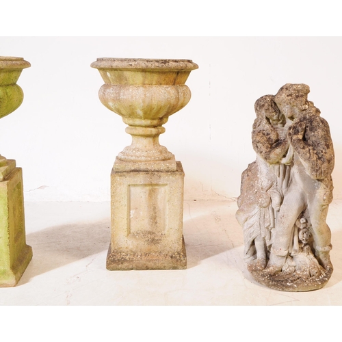 919 - A collection of three stone composite garden planters / jardinières. The collection to include a sin... 