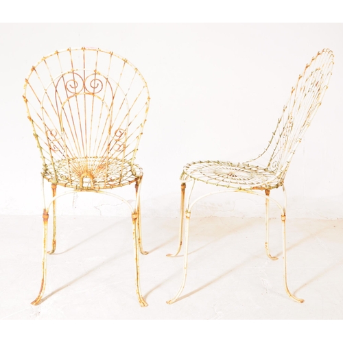 920 - A pair of vintage 20th century wire work metal garden outdoor chairs. Having curved backrest pierced... 