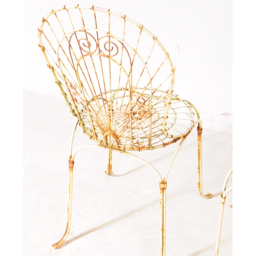 920 - A pair of vintage 20th century wire work metal garden outdoor chairs. Having curved backrest pierced... 