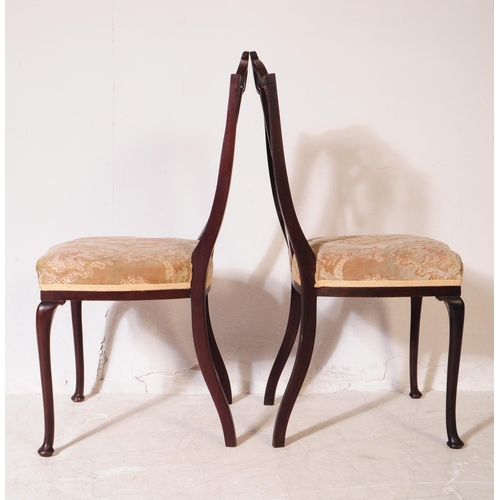 922 - A set of four Edwardian mahogany Hepplewhite dining chairs. With pierced shield back backrest on dam... 