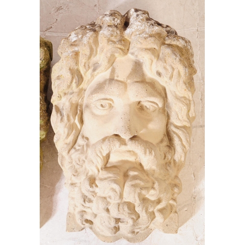 923 - Two stone architectural composite garden plaque bust faces. One plaque being in the form of Zeus, th... 