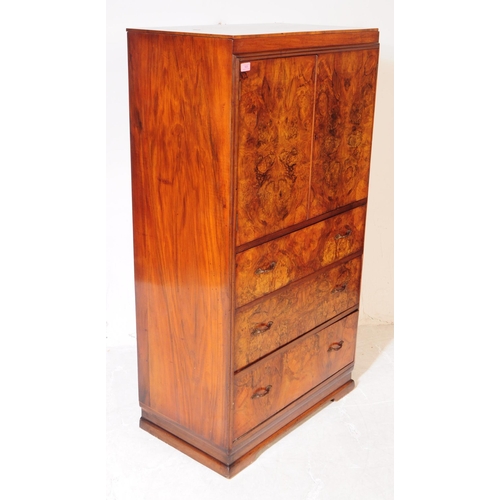 925 - An Art Deco circa 1930s figured burr walnut tallboy chest of drawers. Rectangular form with twin cab... 