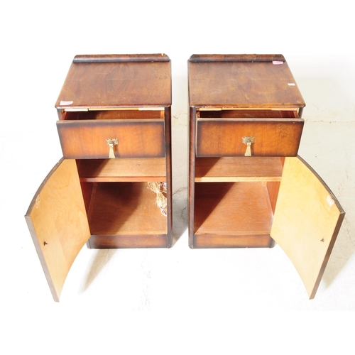 931 - A pair of mid 20th century Post War Art Deco oak veneer pot cupboards / bedside tables. The bedsides... 