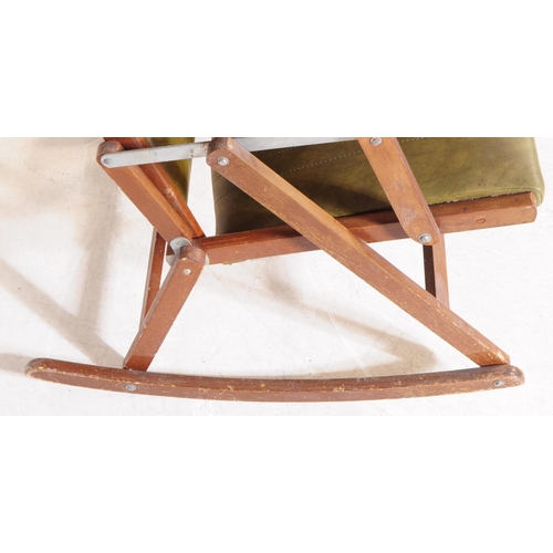 933 - A19th century steamer / deck style oak wood folding rocking chair. The chair featuring green leather... 