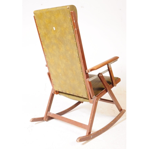 933 - A19th century steamer / deck style oak wood folding rocking chair. The chair featuring green leather... 